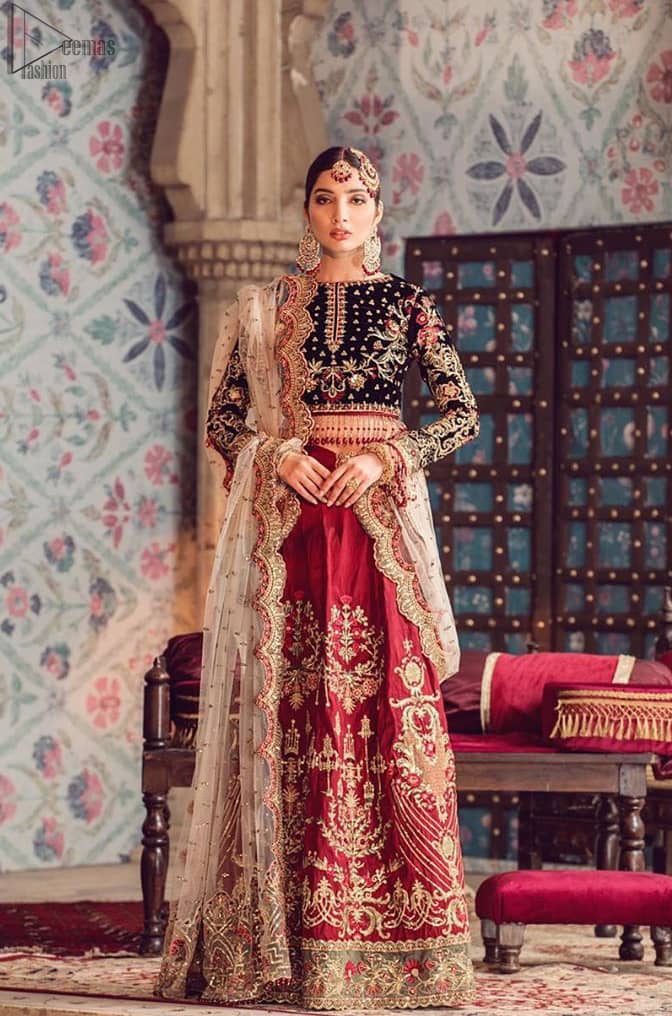 The new season is all about making a statement. Captured in traditional silhouette, The bridal stands out due to its uniqueness and the perfect fusion of modern cut and traditional embroidery. Black velvet blouse is beautifully decorated with multiple colour embroidery and finished with tassels. It comes with full embellished velvet lehenga adorned with applique all around the edges and motifs all over it. This outfit is coordinated with beige net dupatta which is sprinkled with sequins all over it. It is further furnished with a four-sided scalloped border.