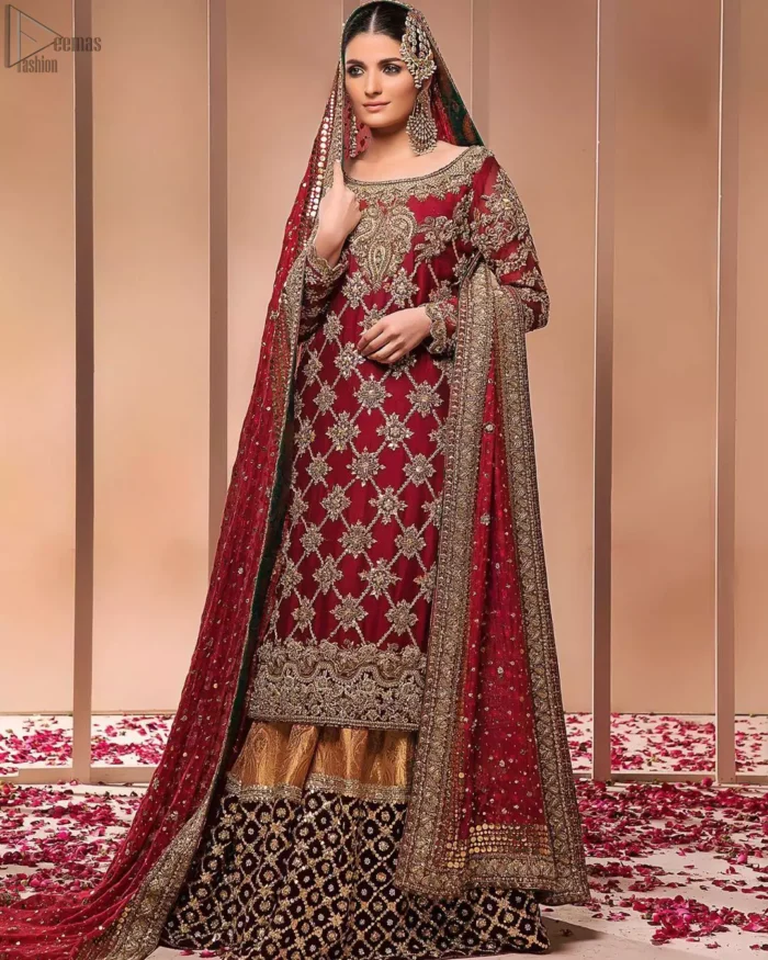 This style-savvy bride totally pulled off our classic bridal wear with an unmatchable grace and giving major bridal goals. The lehenga colour is the perfect feminine and delicate shade with its meticulously crafted fabrication with geometrically embellished border filled with gorgeous tiny floral motifs in it. The shirt is beautifully ornamented with geometrically arranged motifs and intricate details at the bottom. The zardozi embroidery is done in the shade of tan. Pair it up with maroon organza dupatta adorned with sterling sequences and four-sided embellished borders to give it a regal look.