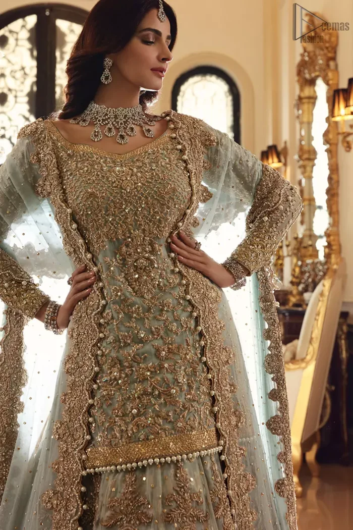 This colour is the perfect feminine and delicate shade with its meticulously crafted fabrication with the flow of organza dusted with pearls to the richness of the shirt and dupatta pallu bordered with gorgeous embroideries. Adorned with sterling sequences and silver and crystal hand embellishments, its a classic modern masterpiece. Lehenga is emphasized with two layers of fabrics, the inner layer is of banarsi and the upper layer is fully embellished with zardozi work. Embroidery is done in the shades of antique and silver. The outfit is complemented with a mint green dupatta with chann all over and finishing with handwork borders all around the edges.