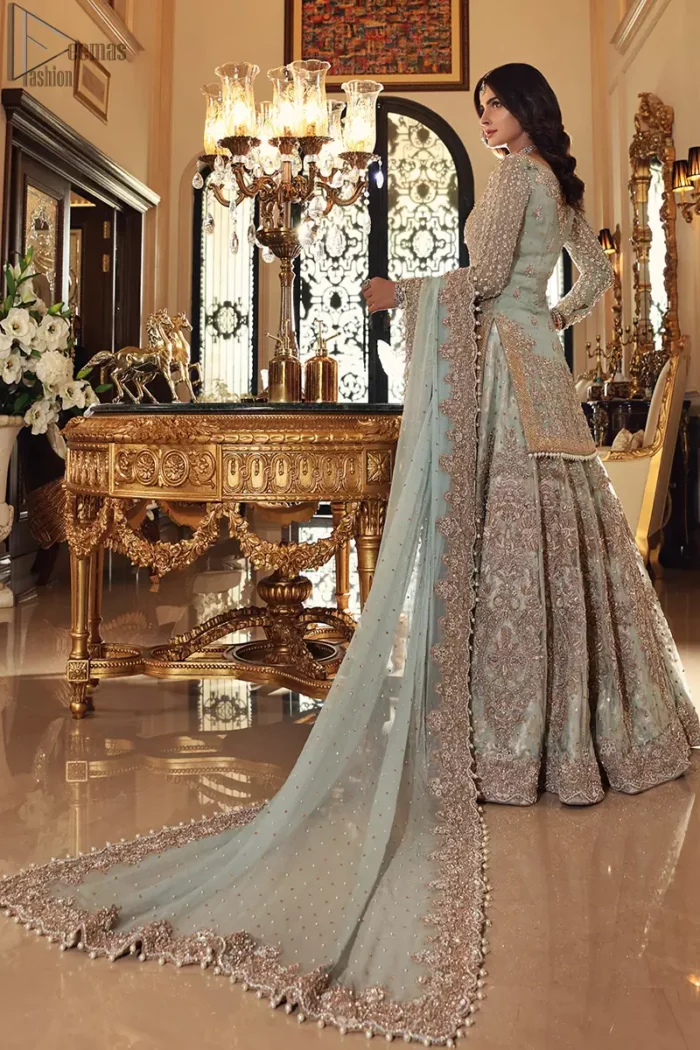 This colour is the perfect feminine and delicate shade with its meticulously crafted fabrication with the flow of organza dusted with pearls to the richness of the shirt and dupatta pallu bordered with gorgeous embroideries. Adorned with sterling sequences and silver and crystal hand embellishments, its a classic modern masterpiece. Lehenga is emphasized with two layers of fabrics, the inner layer is of banarsi and the upper layer is fully embellished with zardozi work. Embroidery is done in the shades of antique and silver. The outfit is complemented with a mint green dupatta with chann all over and finishing with handwork borders all around the edges.