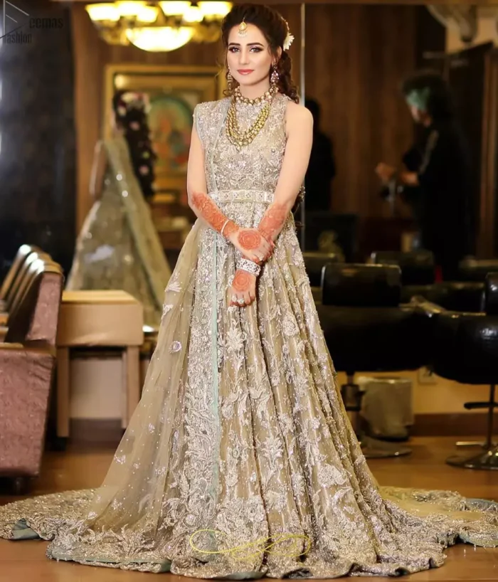Your graceful personality demands a royal touch, which is why the Fawn Back Train Maxi ensures imperial distinctiveness. As per its highly admirable looks, this exquisite bridal wear is made sleeveless and adorned with exemplary silver embroidery to give it the most majestic vibes. Dresses for whom uniqueness prevails, a halterneck works outstandingly as an icing on a cake. Pure organza is chosen as the graceful fabric for the maxi, whereas the churidar pajama is made with the smoothest raw silk. Not to forget, a final add-up of an elegant net dupatta, and this ravishing attire is all set to dazzle up your Walima.