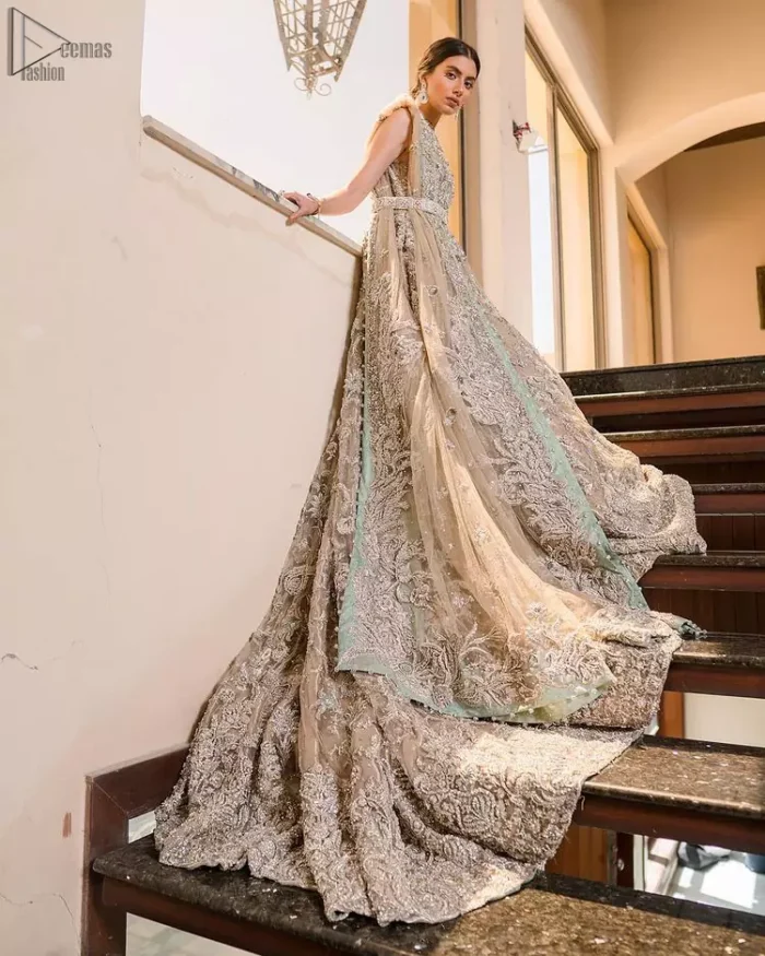 Your graceful personality demands a royal touch, which is why the Fawn Back Train Maxi ensures imperial distinctiveness. As per its highly admirable looks, this exquisite bridal wear is made sleeveless and adorned with exemplary silver embroidery to give it the most majestic vibes. Dresses for whom uniqueness prevails, a halterneck works outstandingly as an icing on a cake. Pure organza is chosen as the graceful fabric for the maxi, whereas the churidar pajama is made with the smoothest raw silk. Not to forget, a final add-up of an elegant net dupatta, and this ravishing attire is all set to dazzle up your Walima.