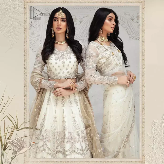 Designed with great expertise, the Ivory Blouse Lehenga is going to set you on a heavenly journey, full of comfort, merriment and unlimited beauty. In a professional sense of full sleeves, the dress is laudable for its majestic light golden and silver embroidery under the very meritorious round neckline. To contribute towards its eminence, this bridal wear is made with the finest organza. A lehenga and an exquisite net dupatta make this marvelous attire a paragon of extreme beauty on your Walima.