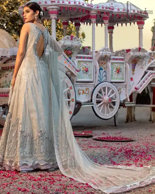 Light gray pure banarsi jamawar blouse, lehenga with front open long jacket having multiple layered frill.