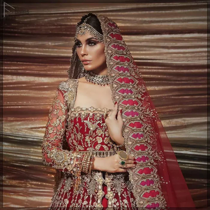 A bride wants to feel as beautiful as she is on her special day, and knowing that our Lehenga was the final decision in that, it is priceless. This bold and iconic bridal ensemble with its dainty flutter silhouette leaves us feeling whimsical, romantic, and even a bit enchanted. This front open pishwas is laden with silver and golden zardozi work, a beautifully crafted waist belt and floral embroidery patterns. The dress is even more enhanced with the ruffled bottom. It is coordinated with a beautiful dupatta with thick matha Patti borders along the length and an intricate beautiful border on the rest of the two sides.