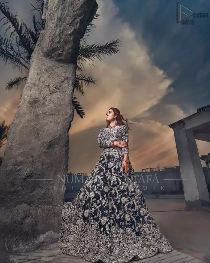 Crafted with love. This outfit is classically designed to make your memorable day beautiful as it should be. Unique craftsmanship and detailed embellishments bring heavenly hued gossamer fabrics to life, creating delicate yet flamboyant pieces of art in our bridal collection. The lehenga is decorated with floral bootis and finished with a heavy thick border with silver zardozi work. Furthermore, the lehenga is also adorned with sprinkled sequins all over it. Complete the look with a navy blue dupatta with tiny floral motifs scattered all over the ground and a four-sided embellished border. 