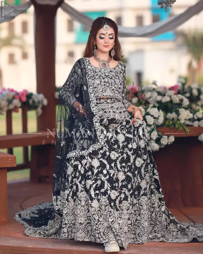 Crafted with love. This outfit is classically designed to make your memorable day beautiful as it should be. Unique craftsmanship and detailed embellishments bring heavenly hued gossamer fabrics to life, creating delicate yet flamboyant pieces of art in our bridal collection. The lehenga is decorated with floral bootis and finished with a heavy thick border with silver zardozi work. Furthermore, the lehenga is also adorned with sprinkled sequins all over it. Complete the look with a navy blue dupatta with tiny floral motifs scattered all over the ground and a four-sided embellished border. 