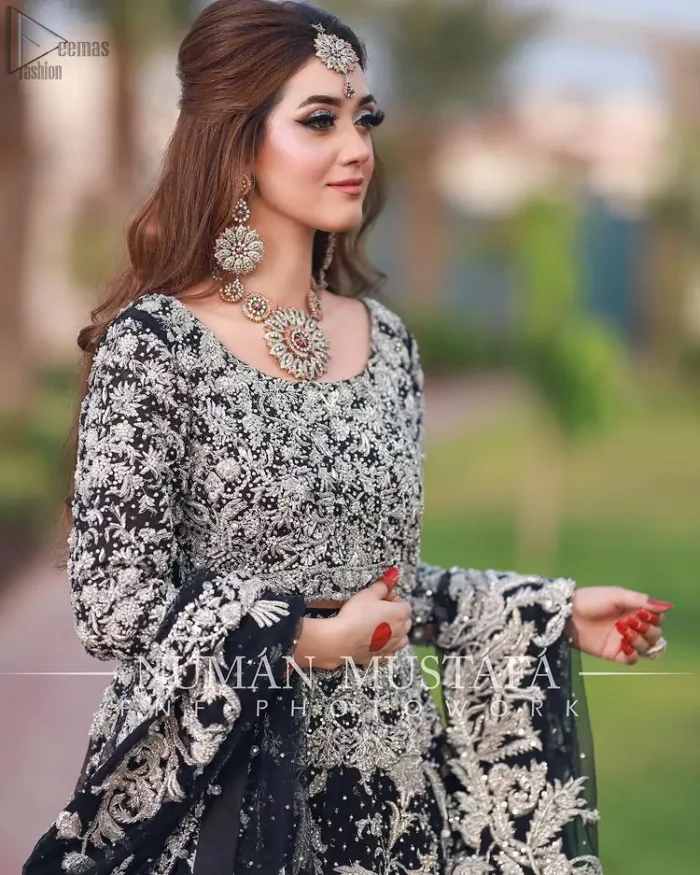 Crafted with love. This outfit is classically designed to make your memorable day beautiful as it should be. Unique craftsmanship and detailed embellishments bring heavenly hued gossamer fabrics to life, creating delicate yet flamboyant pieces of art in our bridal collection. The lehenga is decorated with floral bootis and finished with a heavy thick border with silver zardozi work. Furthermore, the lehenga is also adorned with sprinkled sequins all over it. Complete the look with a navy blue dupatta with tiny floral motifs scattered all over the ground and a four-sided embellished border. 
