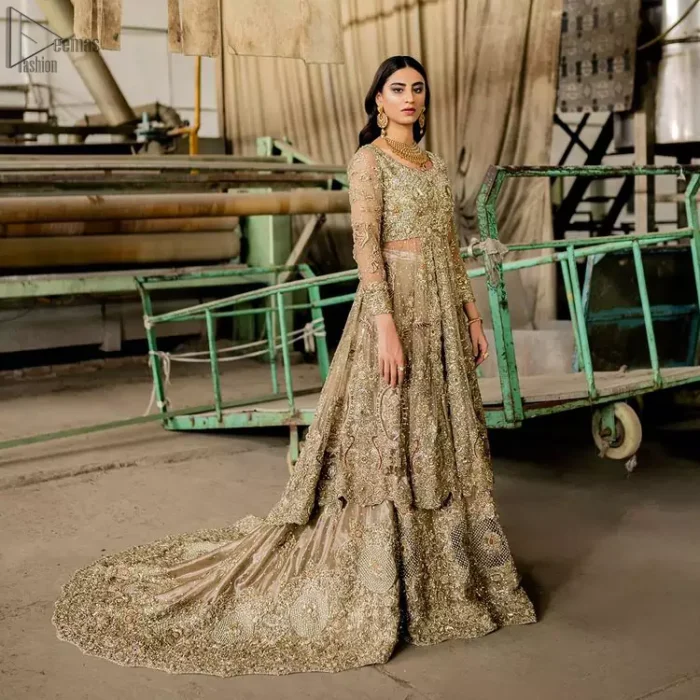 Intricate details, flamboyant silhouettes, and mastery of colour are what makes this dress stand out from the rest. This is one of the elegant pieces that are sure to stay in your heart and your wardrobe forever. The front open frock is immensely decorated with multiple color embroidery. The bodice is fully embroidered and finished the top with a scalloped hemline. Accompanied by a matching back train lehenga emphasized with zardozi work and geometric patterns. Complete the look with a maroon scalloped dupatta, having four-sided embroidered borders and sequins spray on the ground.