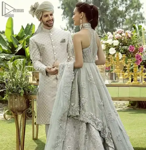 Drape yourself to perfection for the classiest affair in this flattering pastel green ensemble festooned with intricate zardozi hand embroidery