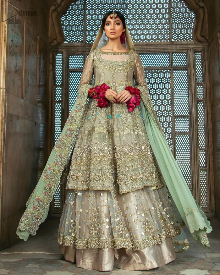 Pastel Green Double Layer Frock - Tea Rose Sharara. Fabulously stitched, Pastel Green double flared frock in maxi style is exquisite indeed. Fully embellished with tilla, dabka, sequins, pearls and silk thread embroidery. The frock body is entirely composed of pure organza with one part round neckline. Frock comes with three-quarter sleeves and it is concealed with a side zip closure. Tea rose pure tissue sharara with decently composed with fixed waist belt with side zip closure is one to wear on nikah or on a wedding day.