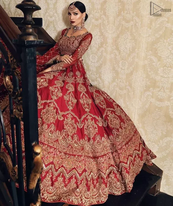 Poise, Beauty, and Charm. Feel pampered in this finely handcrafted celestial-inspired ensemble, deftly ornamented with intricate hand-embroidery. Fitted red blouse with cross-check pattern work and solid embroidery. Pakistani bridal dress comes with a large flare lehenga having multiple panelled embroideries.   Pure Organza dupatta has heavy four-sided borders and cross-checks pattern embroidery. 