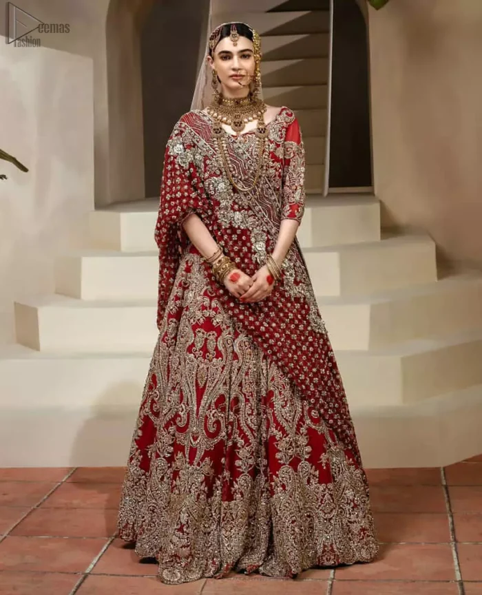 Crafted with love. This dress is classically designed to make your memorable day beautiful as it should be. This handcrafted remarkable ensemble reflects the aura of the heavenly blouse and includes art deco design elements. A wedding ensemble from the house of DeemasFashion in which the intricate detailing makes all the difference. A delicate arrangement of hand-embellished floral patterns with zardozi work makes the skirt more attractive. Complete the look with a maroon organza dupatta adorned with four-sided embellished borders and tiny floral motifs scattered all over the ground.