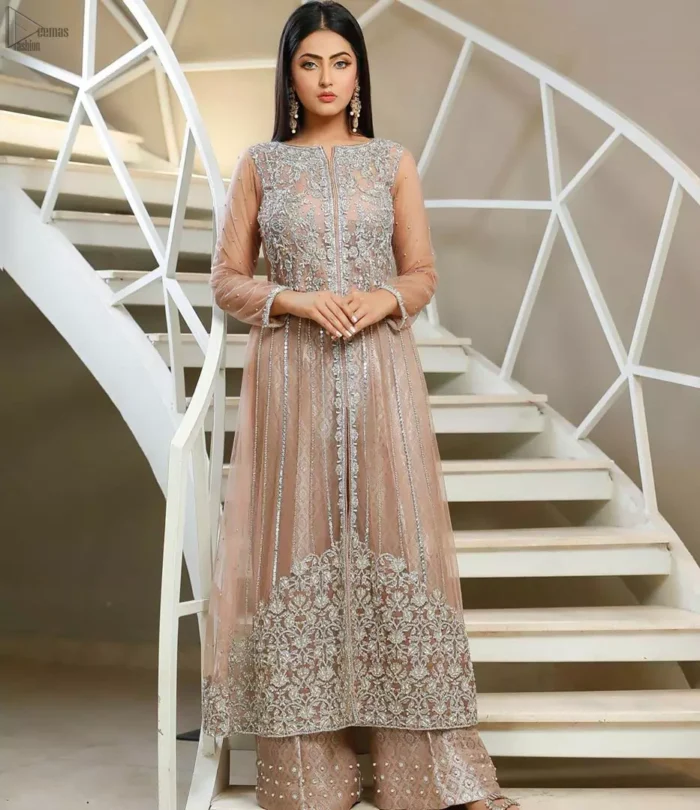 With pure fabric heavily embroidered with zardozi and the perfect blend of traditional flamboyance and modern elegance in design, you need to look no further for the perfect look for any formal occasion. The shirt is delicately crafted with silver zardozi work. The bodice is heavily laden with silver embellishment. Pair it up with tea rose palazzo pants scattered pearls on the bottom edge. The outfit is coordinated with net dupatta having kiran on all four sides.