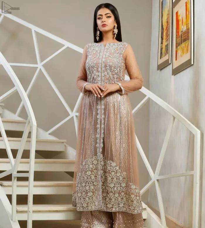 With pure fabric heavily embroidered with zardozi and the perfect blend of traditional flamboyance and modern elegance in design, you need to look no further for the perfect look for any formal occasion. The shirt is delicately crafted with silver zardozi work. The bodice is heavily laden with silver embellishment. Pair it up with tea rose palazzo pants scattered pearls on the bottom edge. The outfit is coordinated with net dupatta having kiran on all four sides.