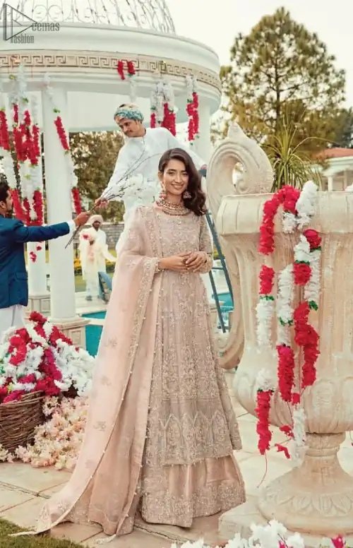 Bringing traditional charm to your big day with intricately silver and light golden embellished neckline and thick worked lin