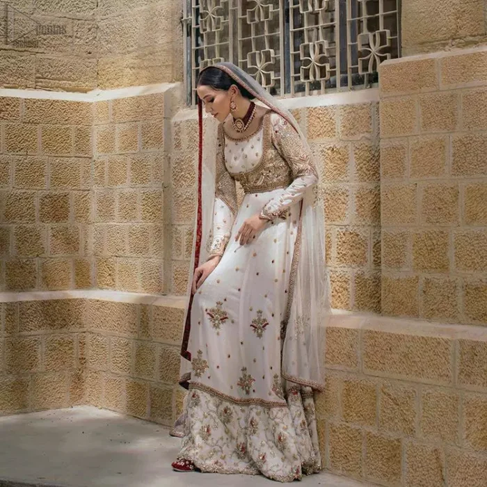 Exceptionally styled and symphonized stitching makes you gorgeous enough that it would surely make your big days remembering one. The Ivory Pishwas Frock is a true beauty when it comes to the work of perfection. Latest Nikah Dress - Ivory Pishwas Frock n Dupatta.