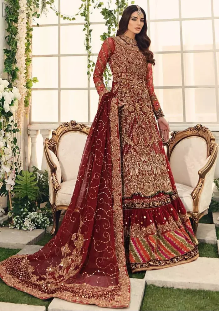 Bridal Wear Maroon Shirt n Dupatta – Chatta Patti Gharara. Framed in a Beautiful Shirt and Dupatta both in the same Maroon colour along Chatta Patti Lehenga is One To Wear. Multicolour copper embroidery on Shirt and Lehenga is fully embellishing with Appliques, Sequins, Tilla and Dabka work. Plus on Duppata too of Organza fabric same as that of Shirt and Lehenga which is fully sprayed with sequins and Tilla work. Along with finished edges and fixed waist belt with side zip closure. The shirt is with a round neckline and full Sleeves which are in full length; too completely engraved with embroidery plus floral motifs on Dupatta increasing the whole gorgeousness.