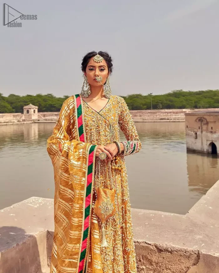 Latest Mehndi Wear - Mustard Angrakha Frock - Chatta Patti Dupatta. A beautiful touch of light golden embroidery embellished with sparkling pearls follows a fascinating churidar pajama, finally concluding the dress.
