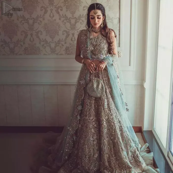 Nikah Wear - Pastel Blue Lehenga Blouse. While the pearl and sequins work all over the pastel blue dupatta contributing the most to the charm.