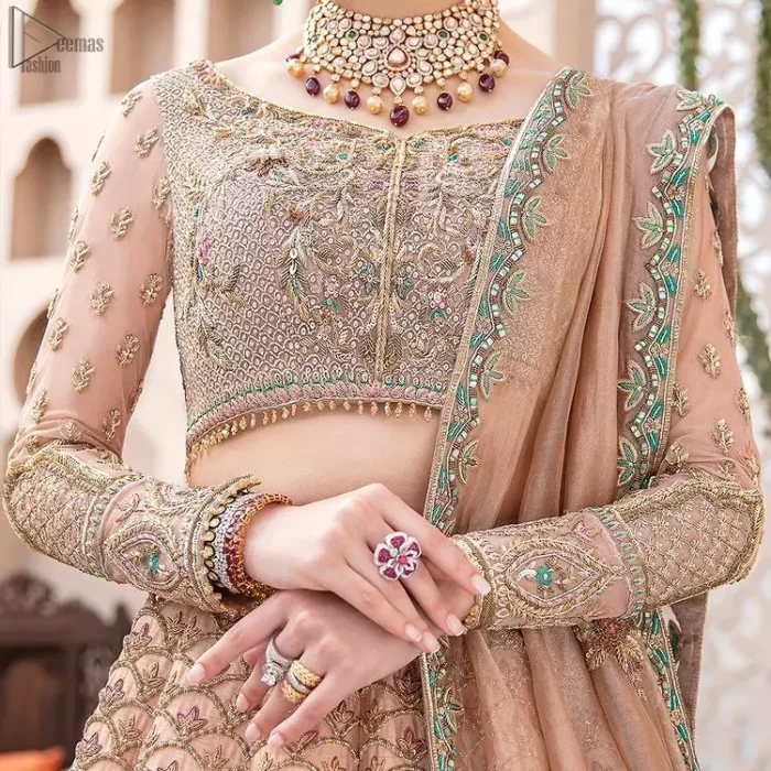Pakistani Wedding Wear Peach Blouse Lehenga. DupattaThis breathtaking fit and flare wedding dress offers comfort without compromising on style. This nude peach colour is the perfect feminine and delicate shade with its meticulously crafted fabrication with gorgeous embroideries. The multiple colour embroidery The outfit comes with an embroidered belt. Adorned with sterling sequences and silver and crystal hand embellishments, it's a classic modern masterpiece!