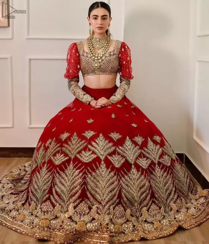 The red Lehenga Blouse comes with full sleeves and is made with the purest organza, while a sweetheart neckline follows mesmerizing light golden embroidery, giving the dress a touch of glamour. A perfect treat to your reception day. Red Blouse – Solid Embroidered Lehenga Reception Day.
