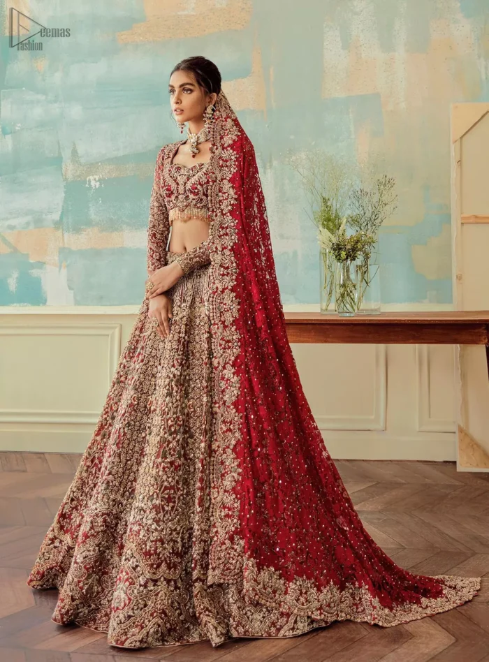 Come up with something fab on your wedding day, with a meritorious Red Lehenga Blouse. A full-sleeved attire made with pure organza follows a beautiful light golden embroidery under a stylish sweetheart neckline. This mesmerizing dress would fulfil your expectations on your reception day. Pakistani Bridal Wear - Red Sweetheart Neckline Blouse n Lehenga.