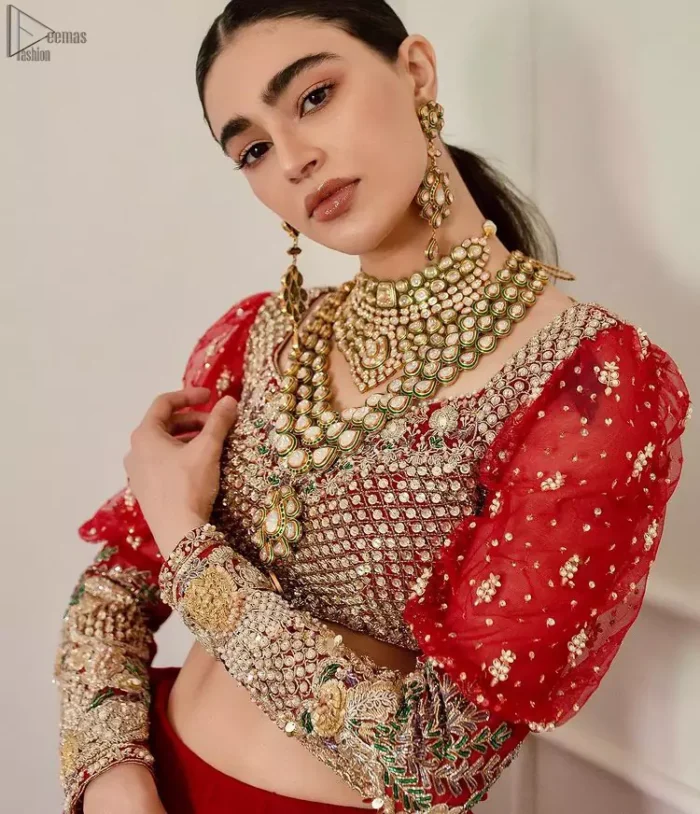 The red Lehenga Blouse comes with full sleeves and is made with the purest organza, while a sweetheart neckline follows mesmerizing light golden embroidery, giving the dress a touch of glamour. A perfect treat to your reception day. Red Blouse – Solid Embroidered Lehenga Reception Day.