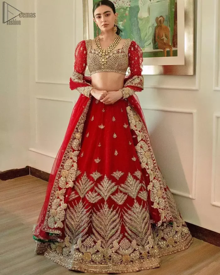 The red Lehenga Blouse comes with full sleeves and is made with the purest organza, while a sweetheart neckline follows mesmerizing light golden embroidery, giving the dress a touch of glamour. A perfect treat to your reception day. Red Blouse – Solid Embroidered Lehenga Reception Day.
