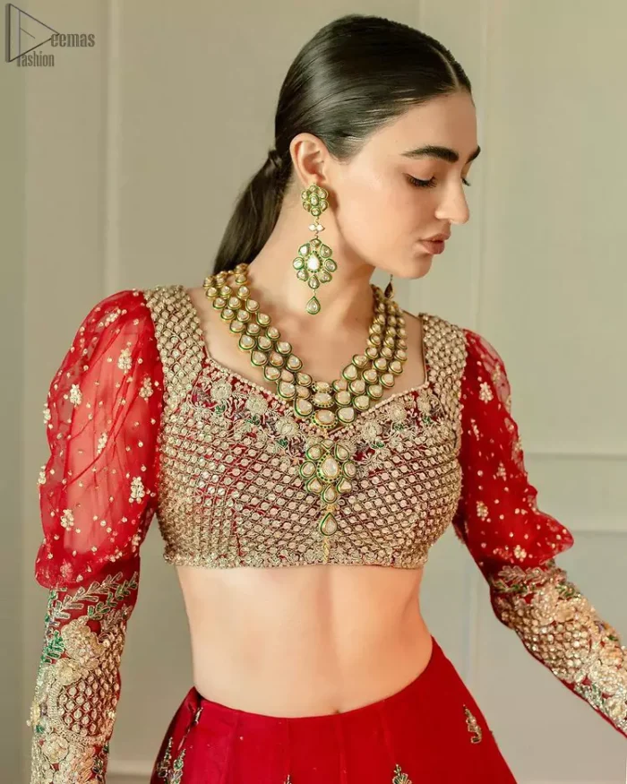 The red Lehenga Blouse comes with full sleeves and is made with the purest organza, while a sweetheart neckline follows mesmerizing light golden embroidery, giving the dress a touch of glamour. A perfect treat to your reception day. Red Blouse – Solid Embroidered Lehenga Reception Day.