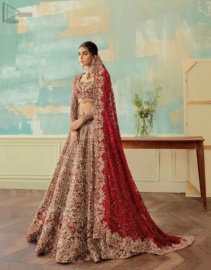 Come up with something fab on your wedding day, with a meritorious Red Lehenga Blouse. A full-sleeved attire made with pure organza follows a beautiful light golden embroidery under a stylish sweetheart neckline. This mesmerizing dress would fulfil your expectations on your reception day. Pakistani Bridal Wear - Red Sweetheart Neckline Blouse n Lehenga.