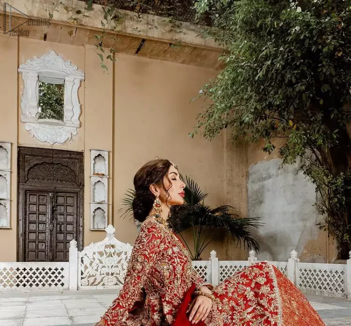 Red Bridal Peplum n Dupatta – Orange Lehenga. Red peplum with pure organza and fully engraved multi colour embroidery is such an eye-catching masterpiece that you would like to wear on your big day. Silver and golden combination of embellishment along with red pearls, Tilla Dabka, Appliques, Sequins and Zardozi work mainly gives such an eye feasting outfit to wear. The rounded, neckline and full sleeves give it a proper finishing in a beautiful attractive peplum style with Kattan Banarsi Jamawar exquisite Lehenga. With a concealed side zip closure along with floral motifs having finished edges. The Red organza dupatta has four-sided embellished borders.