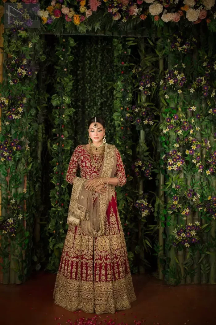 Looking perfectly gorgeous is not a mere utopia. You already appear stunning but with the Crimson Lehenga Blouse on you, things will definitely get unimaginably beautiful. A marvellous combination of a three-quarter sleeved Crimson blouse choli, an elegant lehenga and a tan net dupatta, dazzle up the dress with unexplainable enchantment. The attire features a heavy centre panel and a mesmerizing round neckline, designed with skill and accuracy. To add more to its exquisiteness, a fascinating work of golden embroidery follows an outstanding adornment of floral motifs. Graceful as it is, pure organza blooms its meritoriousness, making the dress a whole treat to your reception day.