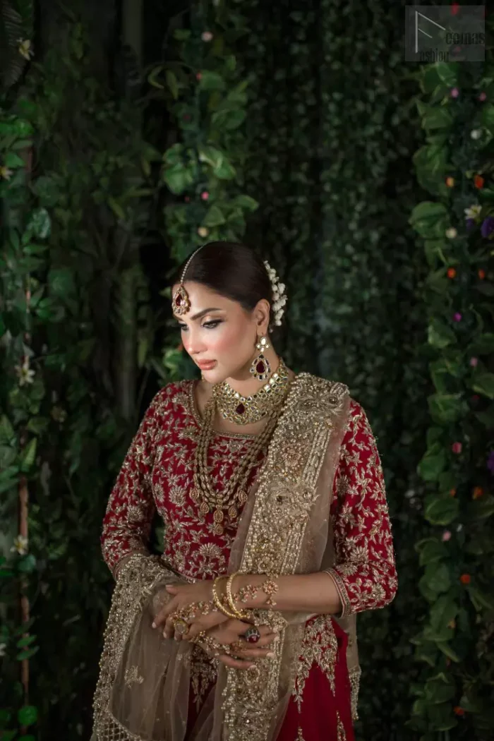 Looking perfectly gorgeous is not a mere utopia. You already appear stunning but with the Crimson Lehenga Blouse on you, things will definitely get unimaginably beautiful. A marvellous combination of a three-quarter sleeved Crimson blouse choli, an elegant lehenga and a tan net dupatta, dazzle up the dress with unexplainable enchantment. The attire features a heavy centre panel and a mesmerizing round neckline, designed with skill and accuracy. To add more to its exquisiteness, a fascinating work of golden embroidery follows an outstanding adornment of floral motifs. Graceful as it is, pure organza blooms its meritoriousness, making the dress a whole treat to your reception day.