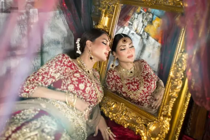 Looking perfectly gorgeous is not a mere utopia. You already appear stunning but with the Crimson Lehenga Blouse on you, things will definitely get unimaginably beautiful. A marvellous combination of a three-quarter sleeved Crimson blouse choli, an elegant lehenga and a tan net dupatta, dazzle up the dress with unexplainable enchantment. The attire features a heavy centre panel and a mesmerizing round neckline, designed with skill and accuracy. To add more to its exquisiteness, a fascinating work of golden embroidery follows an outstanding adornment of floral motifs. Graceful as it is, pure organza blooms its meritoriousness, making the dress a whole treat to your reception day.
