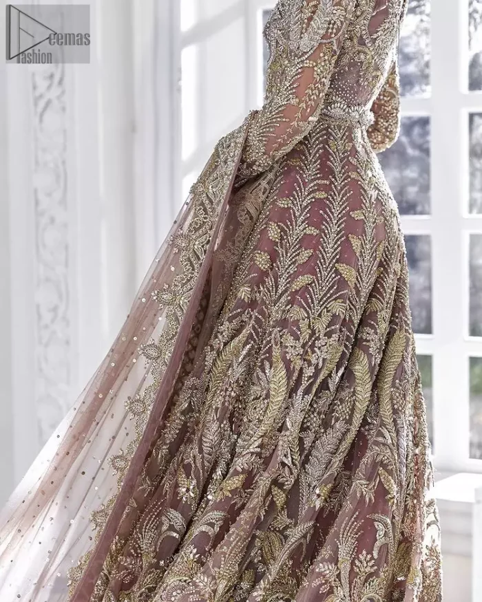 Every bride is the queen of her big day, which is why she deserves an imperial look. The Tea Pink Front Open Maxi Dupatta serves the most queenly gorgeousness with its royal full sleeves and a ravishing front open. But it's not all so simple, a complex and skilful work of silver and light golden embroidery, under its stunning V-neckline, adds more to its worth. The very meritorious back train and its exquisite dupatta with criss-cross patterns mark this exceptional attire as an embodiment of true royalty. Gracefulness along with extreme beauty is what we are looking for, hence, the dress is made with fine organza making the dress fully ready to gratify your imaginations on your Nikkah or Walima.