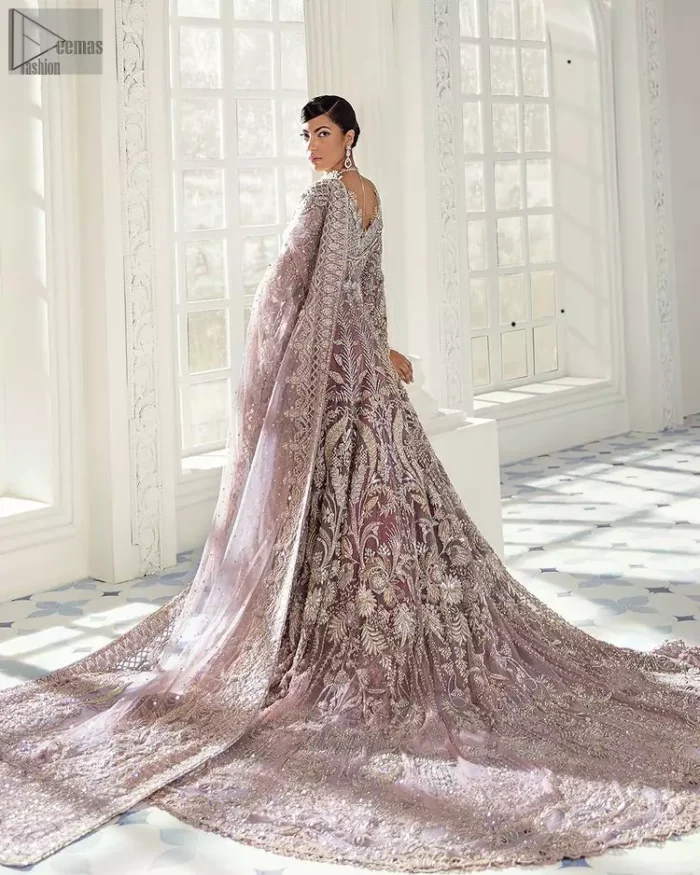Every bride is the queen of her big day, which is why she deserves an imperial look. The Tea Pink Front Open Maxi Dupatta serves the most queenly gorgeousness with its royal full sleeves and a ravishing front open. But it's not all so simple, a complex and skilful work of silver and light golden embroidery, under its stunning V-neckline, adds more to its worth. The very meritorious back train and its exquisite dupatta with criss-cross patterns mark this exceptional attire as an embodiment of true royalty. Gracefulness along with extreme beauty is what we are looking for, hence, the dress is made with fine organza making the dress fully ready to gratify your imaginations on your Nikkah or Walima.