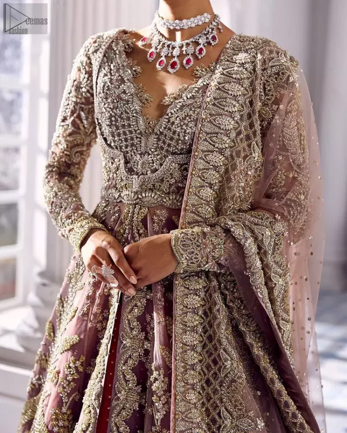 Every bride is the queen of her big day, which is why she deserves an imperial look. The Tea Pink Front Open Maxi Dupatta serves the most queenly gorgeousness with its royal full sleeves and a ravishing front open. But it's not all so simple, a complex and skilful work of silver and light golden embroidery, under its stunning V-neckline, adds more to its worth. The very meritorious back train and its exquisite dupatta with criss-cross patterns mark this exceptional attire as an embodiment of true royalty. Gracefulness along with extreme beauty is what we are looking for, hence, the dress is made with fine organza making the dress fully ready to gratify your imaginations on your Nikkah or Walima.