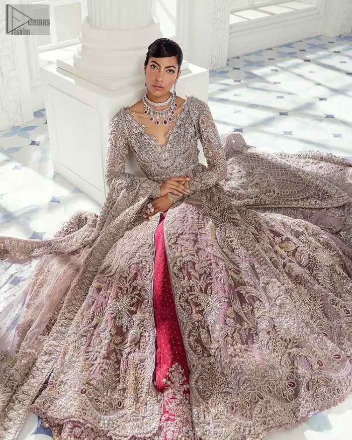 Every bride is the queen of her big day, which is why she deserves an imperial look. The Tea Pink Front Open Maxi Dupatta serves the most queenly gorgeousness with its royal full sleeves and a ravishing front open. But it's not all so simple, a complex and skilful work of silver and light golden embroidery, under its stunning V-neckline, adds more to its worth. The very meritorious back train and its exquisite dupatta with criss-cross patterns mark this exceptional attire as an embodiment of true royalty. Gracefulness along with extreme beauty is what we are looking for, hence, the dress is made with fine organza making the dress fully ready to gratify your imaginations on your Nikkah or Walima.