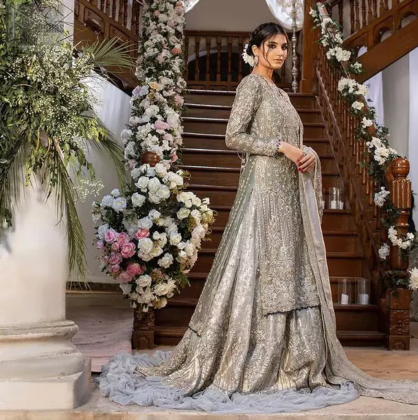 Gratifying yourself with the choice of the right dress is not always easy. But with a full-sleeved Gray Back Train Ruffled Lehenga Shirt,