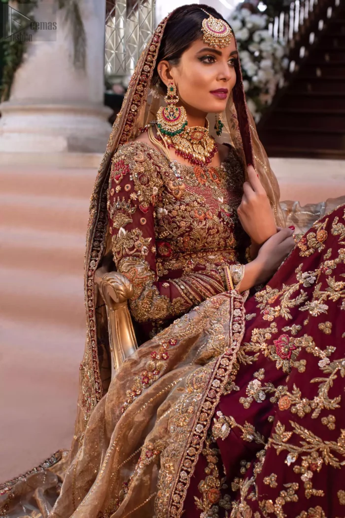 Its laudable can-can style and floral motifs work as the base for the extremely meritorious work of multi-colour embroidery and mirror work under its distinctive boat-shaped neckline. Be the diamond that shines bright the night of your reception day.