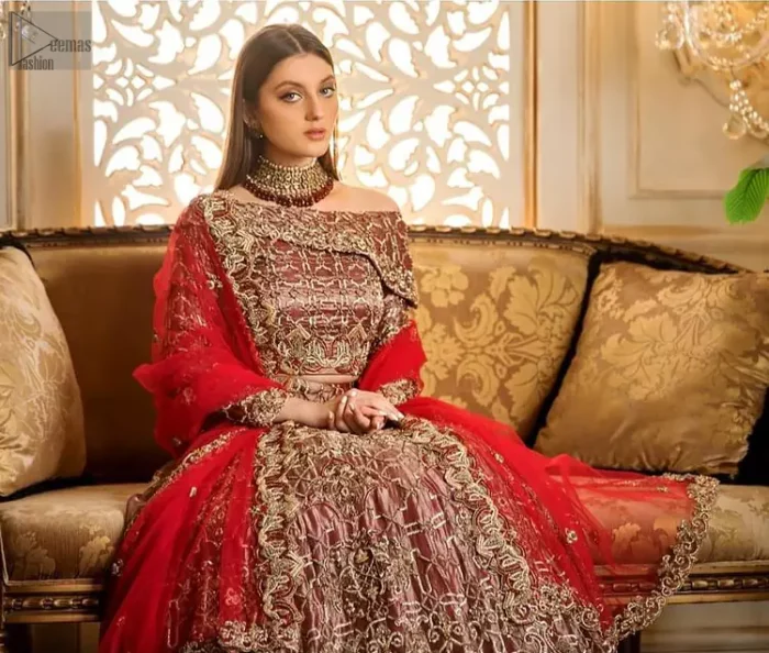 attire displays a skilful work of outstanding sculptured light golden embroidery. Enhancing its elegance, even more, pure organza is the fabric chosen to glorify its magnificence.