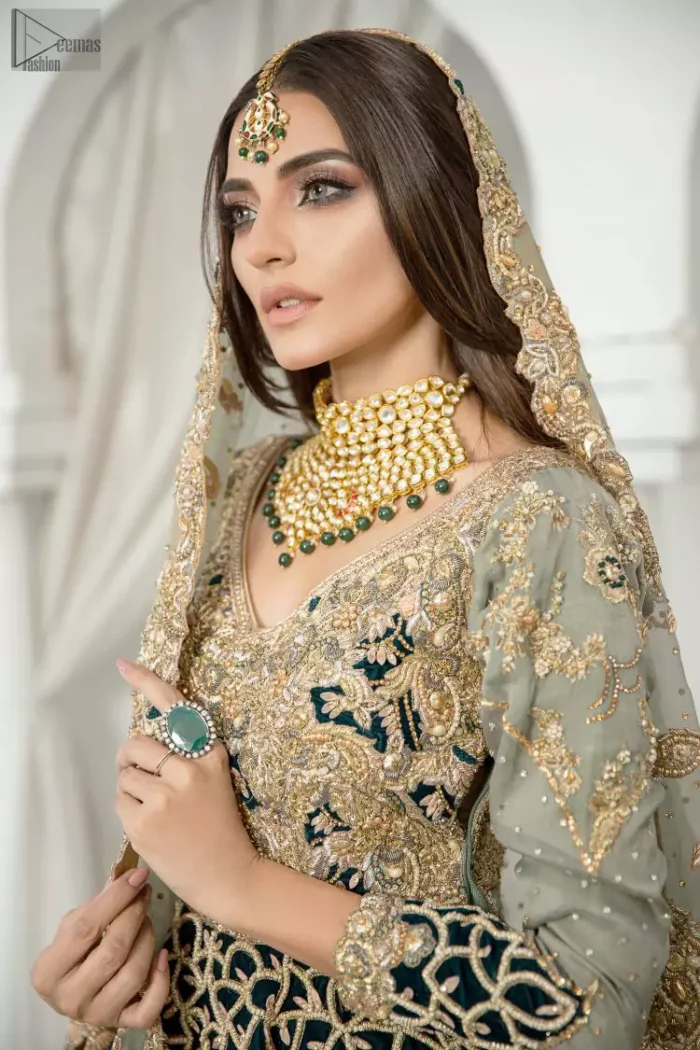 With a fascinating back train, this ravishing bridal wear displays brilliant work of light golden embroidery under its V-neckline. The grace attains due to its finest fabric being organza, the attire speaks for the worthiness of its wearer. Be the glamorous star of the night on your walima.
