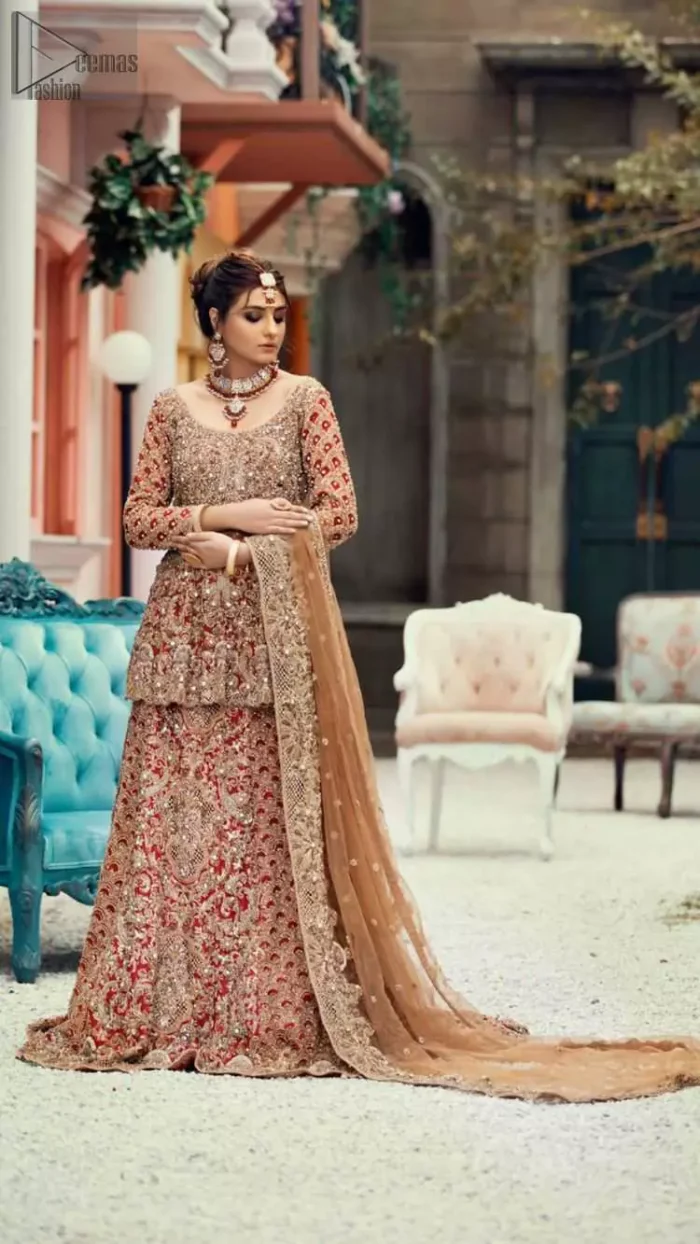 Red Peplum and Lehenga with Rust Net Dupatta. It features a highly remarkable back train and is decorated with fascinating criss-cross patterns. charming as it is, the very exquisite dress code includes a mesmerizing organza peplum, a gorgeous organza lehenga and not to forget, the traditional touch with a net dupatta. 