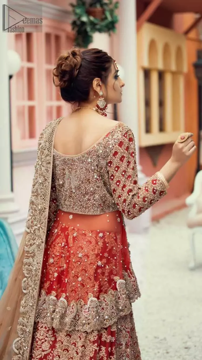 Red Peplum and Lehenga with Rust Net Dupatta. It features a highly remarkable back train and is decorated with fascinating criss-cross patterns. charming as it is, the very exquisite dress code includes a mesmerizing organza peplum, a gorgeous organza lehenga and not to forget, the traditional touch with a net dupatta. 