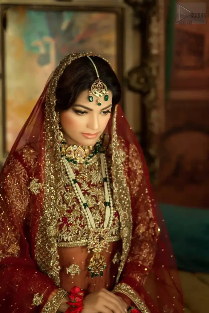 A little blend of the traditional and western styles doubles the gorgeousness of the Red Short Shirt Lehenga. A dress with such dexterity that it holds the magic towards a gorgeous wedding day. Its can-can style and cultural styled full-sleeves are indeed a contribution to the overall exceptional beauty of the dress. Purest organza as the most graceful as well as the comfortable fabric is chosen by our professional designers for this highly ravishing attire. As per the dress's need, a boat-shaped neckline appears admirable, while the exceptional work of golden embroidery assures you of the lots of attraction you'll receive on your Reception day.