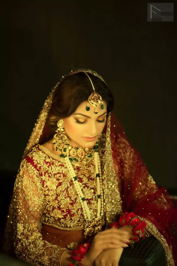 A little blend of the traditional and western styles doubles the gorgeousness of the Red Short Shirt Lehenga. A dress with such dexterity that it holds the magic towards a gorgeous wedding day. Its can-can style and cultural styled full-sleeves are indeed a contribution to the overall exceptional beauty of the dress. Purest organza as the most graceful as well as the comfortable fabric is chosen by our professional designers for this highly ravishing attire. As per the dress's need, a boat-shaped neckline appears admirable, while the exceptional work of golden embroidery assures you of the lots of attraction you'll receive on your Reception day.