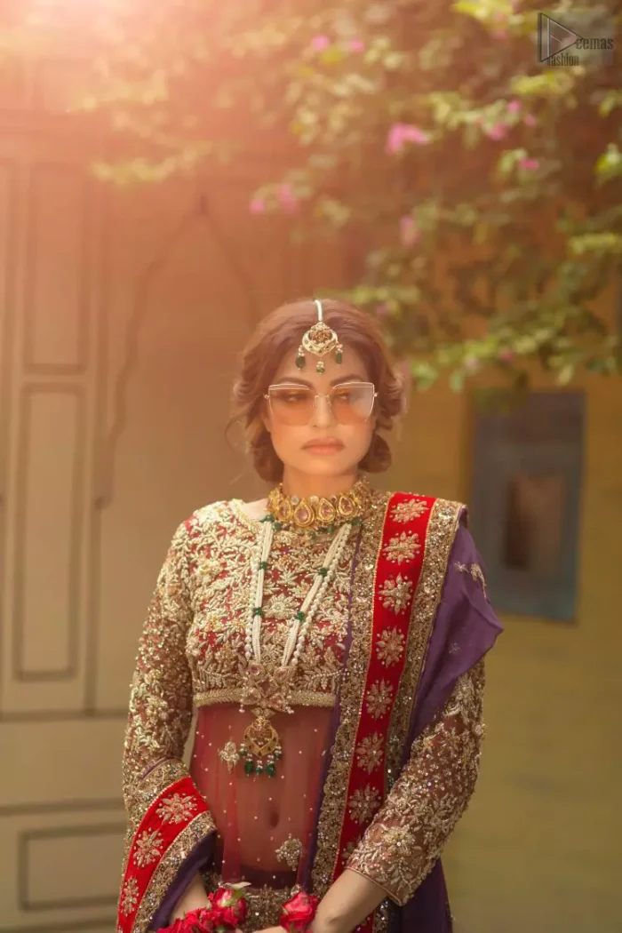 A little blend of the traditional and western styles doubles the gorgeousness of the Red Short Shirt Lehenga. A dress with such dexterity that it holds the magic towards a gorgeous wedding day. Its can-can style and cultural styled full-sleeves are indeed a contribution to the overall exceptional beauty of the dress. Purest organza as the most graceful as well as the comfortable fabric is chosen by our professional designers for this highly ravishing attire. As per the dress's need, a boat-shaped neckline appears admirable, while the exceptional work of golden embroidery assures you of the lots of attraction you'll receive on your Reception day.