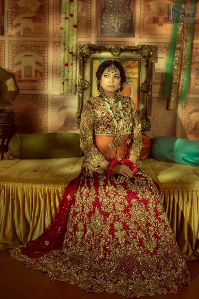 A little blend of the traditional and western styles doubles the gorgeousness of the Red Short Shirt Lehenga. A dress with such dexterity that it holds the magic towards a gorgeous wedding day. Its can-can style and cultural styled full-sleeves are indeed a contribution to the overall exceptional beauty of the dress. Purest organza as the most graceful as well as the comfortable fabric is chosen by our professional designers for this highly ravishing attire. As per the dress's need, a boat-shaped neckline appears admirable, while the exceptional work of golden embroidery assures you of the lots of attraction you'll receive on your Reception day.