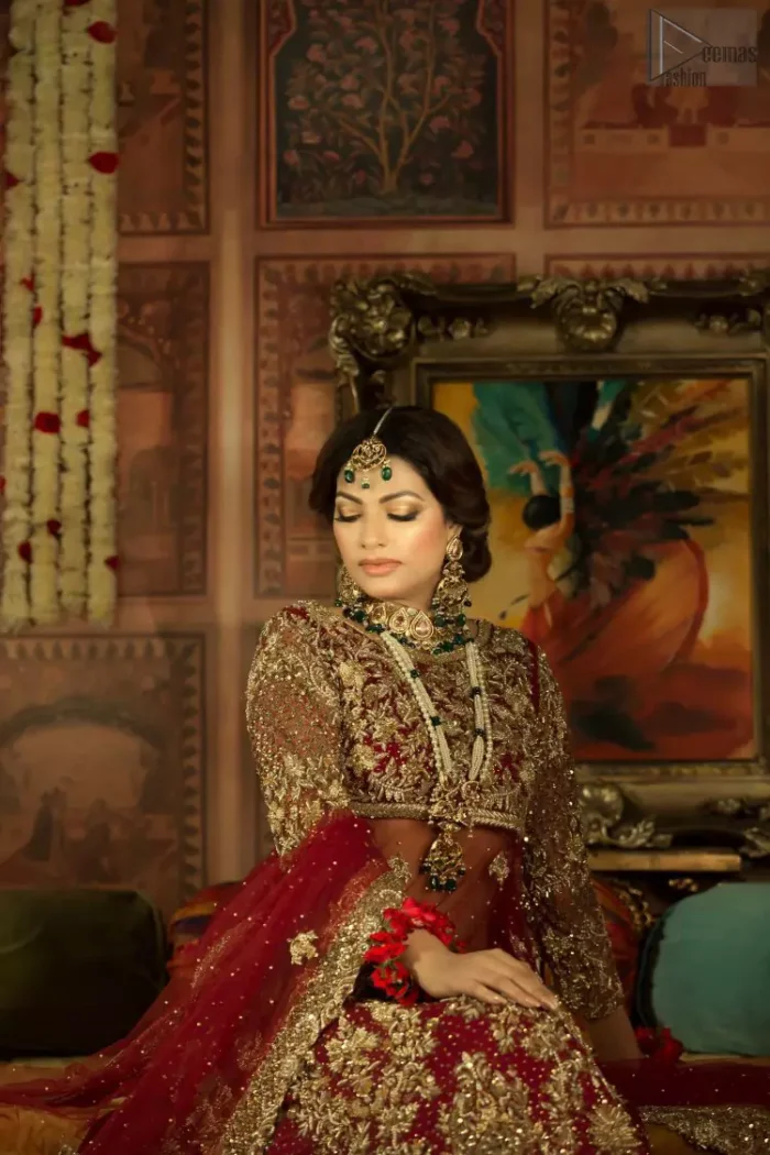 A little blend of the traditional and western styles doubles the gorgeousness of the Red Short Shirt Lehenga. A dress with such dexterity that it holds the magic towards a gorgeous wedding day. Its can-can style and cultural styled full-sleeves are indeed a contribution to the overall exceptional beauty of the dress. Purest organza as the most graceful as well as the comfortable fabric is chosen by our professional designers for this highly ravishing attire. As per the dress's need, a boat-shaped neckline appears admirable, while the exceptional work of golden embroidery assures you of the lots of attraction you'll receive on your Reception day.